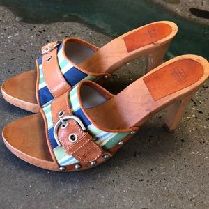 Coach wooden heel with leather buckle.